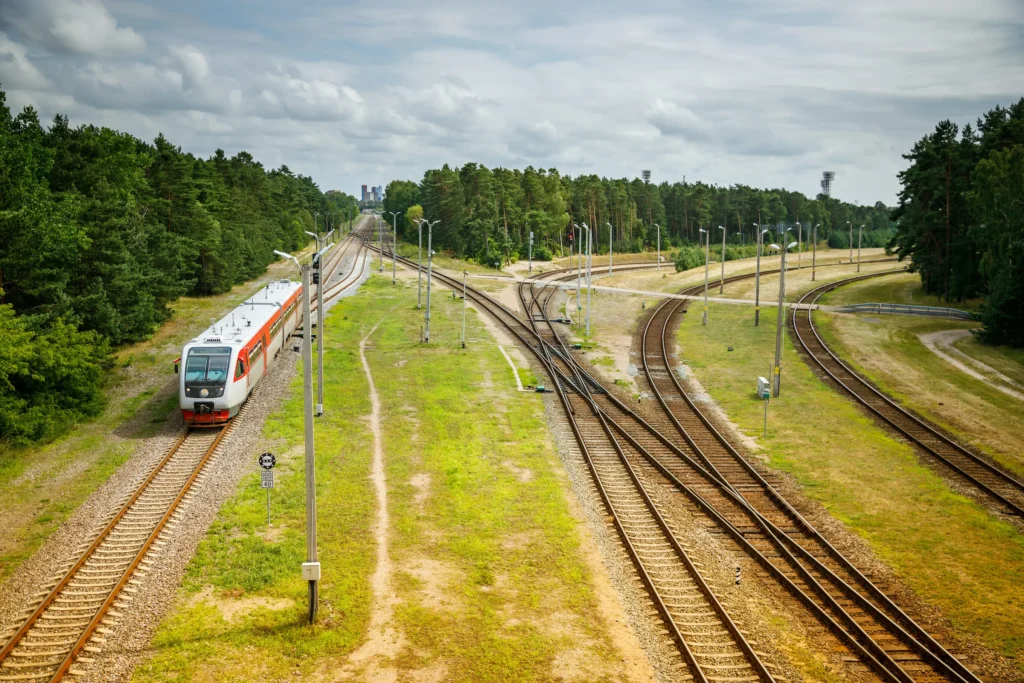 a modern passenger train moving along a railway track
